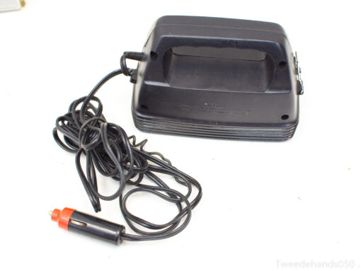 Compact car vacuum with ergonomic handle and long cord for convenient interior cleaning.