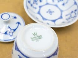 Elegant Bareuther blue and white porcelain dish with intricate floral and geometric patterns.