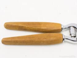 Ergonomic wooden kitchen tools with chrome accents for stylish and efficient cooking tasks.