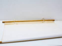Elegant vintage scroll with wooden dowel, perfect for artistic creations and creative inspiration.