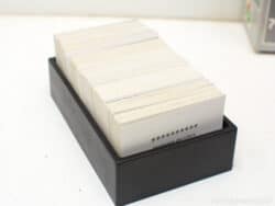 Sleek black box containing organized white cards for effective note-taking and inspiration.