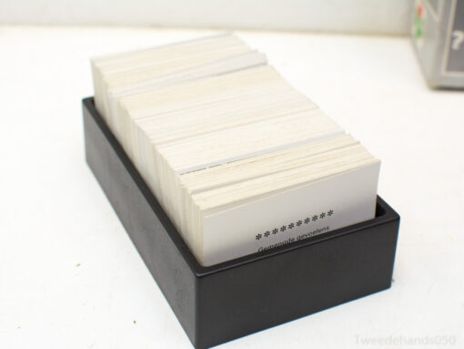 Sleek black box containing organized white cards for effective note-taking and inspiration.
