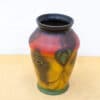 Vibrant vintage vase with abstract designs, perfect for enhancing decor and floral arrangements.