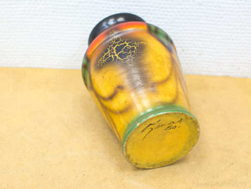 Colorful vintage vase with unique patterns and textures, perfect for decorative accents.