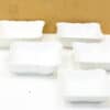 Elegant set of five white serving bowls for versatile dining and stylish décor.