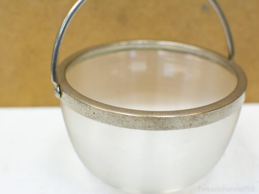 Stylish vintage bucket with a ribbed design and metallic handle, perfect for decor or storage.