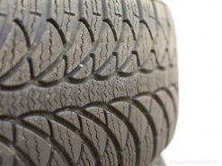Close-up of a vintage tire tread showcasing unique grooves for superior traction and performance.