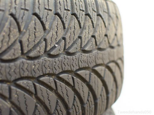 Close-up of a vintage tire tread showcasing unique grooves for superior traction and performance.