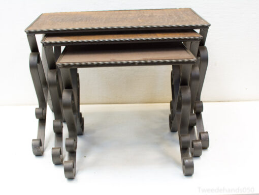 Chic vintage nesting tables in wood and metal, adding style and functionality to any space.