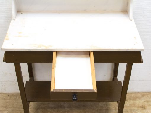 Sturdy white workbench with drawer, perfect for creative projects and versatile workspace solutions.