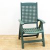 Durable green outdoor chair with ventilation, ideal for comfort in gardens or patios.