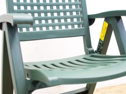 Stylish green outdoor chair with slatted design for comfort and ventilation in patios and gardens.