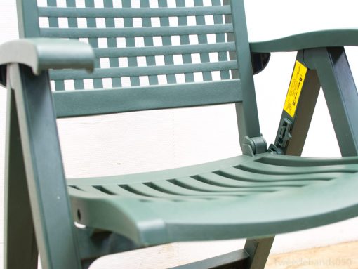 Stylish green outdoor chair with slatted design for comfort and ventilation in patios and gardens.