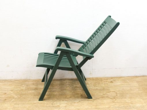 Stylish green reclining chair for ultimate comfort in indoor and outdoor spaces.