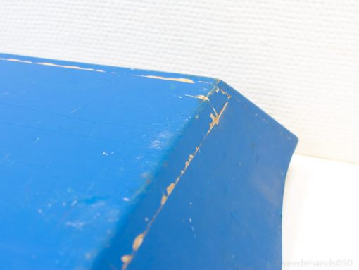 A vintage blue box with unique wear, perfect for decor and storage solutions.