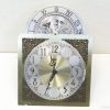 Chic vintage dual-faced clock with ornate design and playful monthly dial in silver.