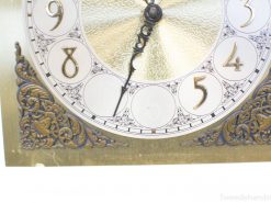 Vintage clock with gold accents and floral designs, perfect for classic decor enthusiasts.
