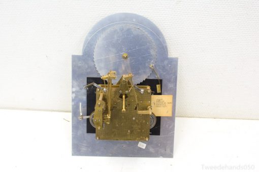 Vintage Franz Hermle clock mechanism with intricate brass gears and classic craftsmanship.