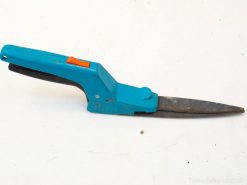 Ergonomic blue scissors with orange button, perfect for precision cutting in crafts and gardening.