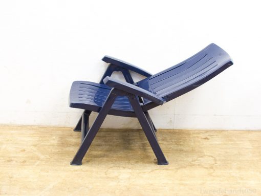 Navy blue ergonomic reclining chair for stylish comfort in indoor and outdoor settings.