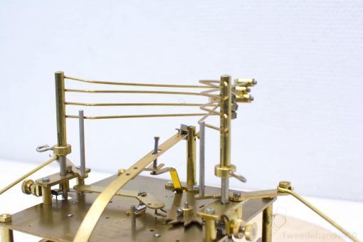Kieninger brass clock: exquisite craftsmanship with intricate mechanics for design enthusiasts and collectors.