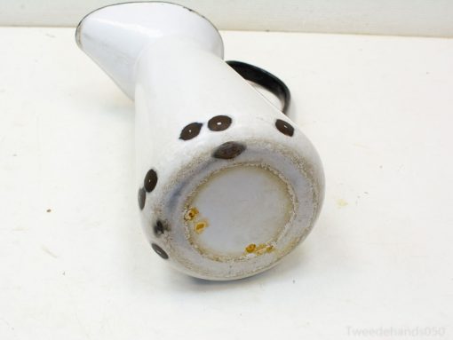 Charming vintage white ceramic jug with unique character, ideal for rustic decor or practical use.