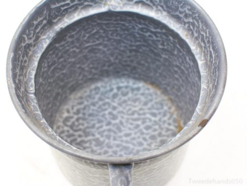 Rustic hammered metal mug, perfect for daily use or as a charming decorative piece.