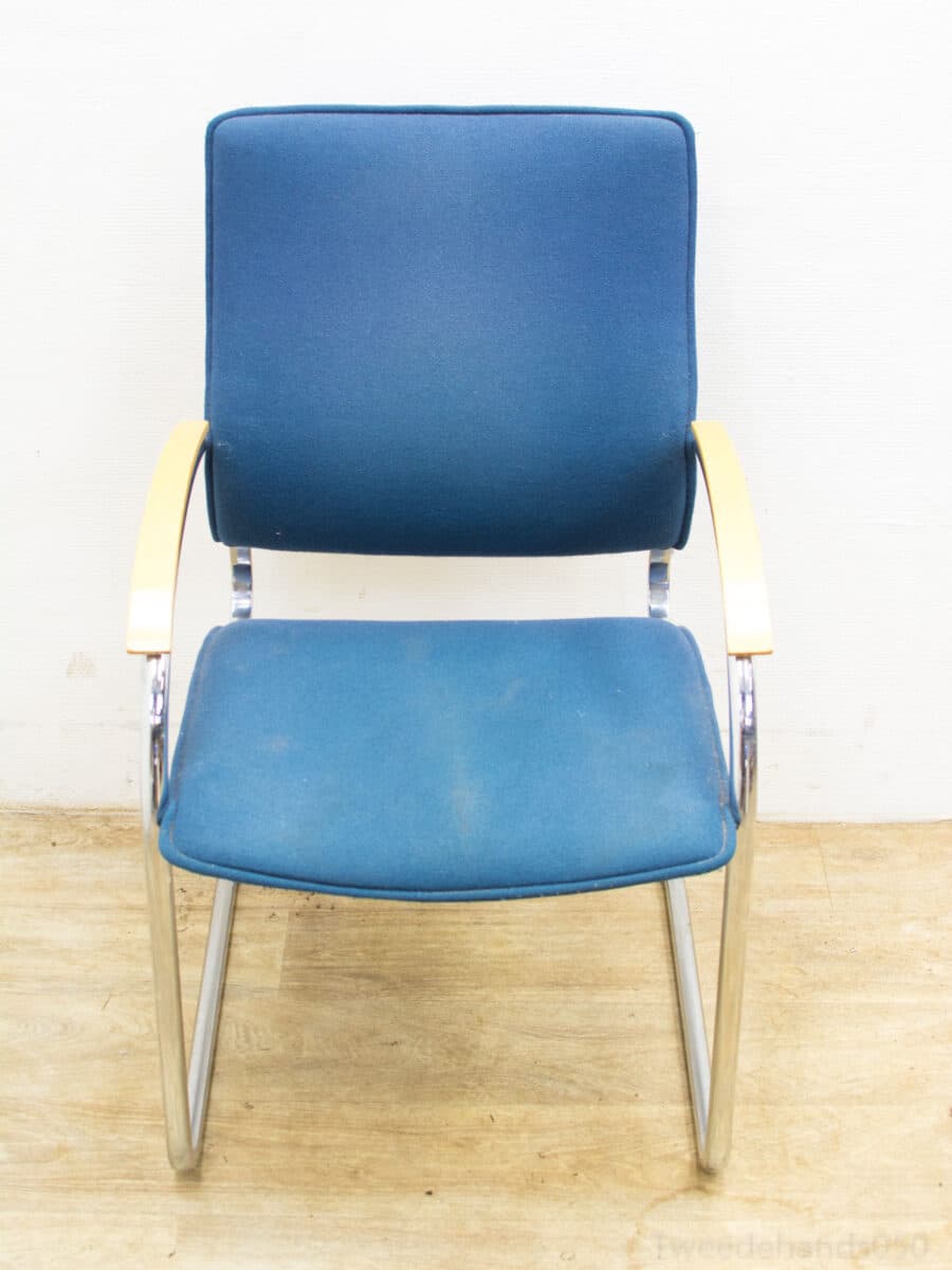 Elegant blue chair with chrome frame and wooden armrests, perfect for any modern space.