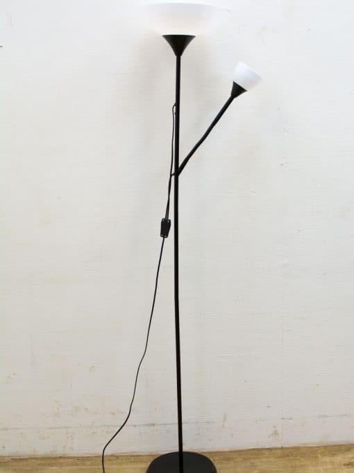 Stylish black floor lamp with bowl shade and flexible reading arm for versatile lighting.