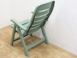 Mint green outdoor chair blending comfort and style for relaxation in any setting.