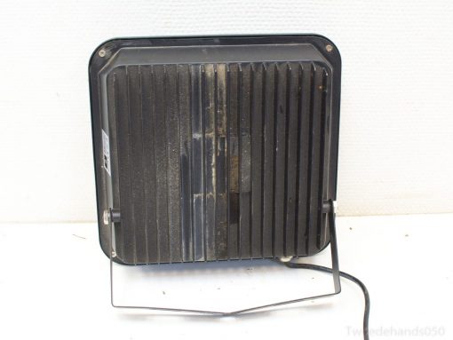 Compact black electric heater with slatted design and adjustable stand for efficient warmth anywhere.