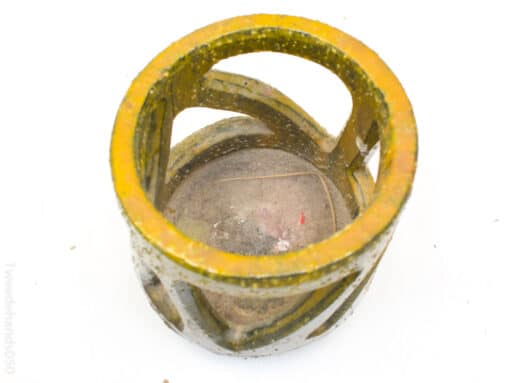 Vintage yellow candle holder with decorative cutouts for stylish and unique home decor.