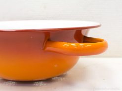 Vibrant orange gradient cooking pot, perfect for adding color and charm to any kitchen.