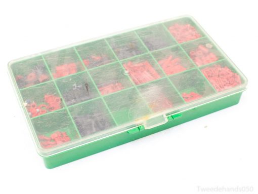 Organize electronic components with this green storage box featuring a clear lid and multiple compartments.