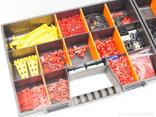 Vibrant toolbox organizing model parts, ideal for DIY enthusiasts and creative projects.