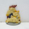 Charming ceramic pigs with colorful bows, ideal for playful home decor and collections.