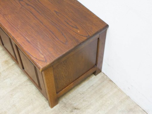 Elegant vintage wooden storage bench adding charm and functionality to any rooms decor.