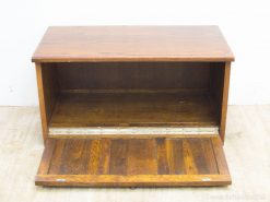Rustic wooden storage chest with a drop-down door, ideal for stylish organization and vintage charm.