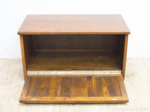 Rustic wooden storage chest with a drop-down door, ideal for stylish organization and vintage charm.