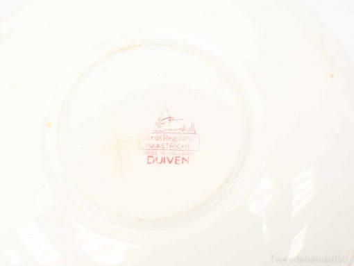 Elegant antique porcelain plate with DUIVEN mark from Maastricht, showcasing exquisite craftsmanship and history.