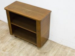 Chic vintage wooden shelf with open design, ideal for books and decor in any space.