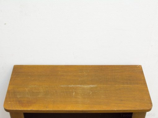 Warm vintage wooden table with rounded edges, ideal for cozy and versatile home interiors.
