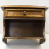 Elegant dark wood nightstand with drawer, enhancing style and functionality in any space.