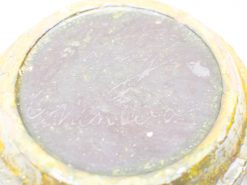 Vintage ceramic bowl with textured glaze and faded inscriptions, ideal for collectors and enthusiasts.