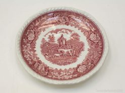 Vintage plate featuring horses in a pastoral scene with an elegant floral border.