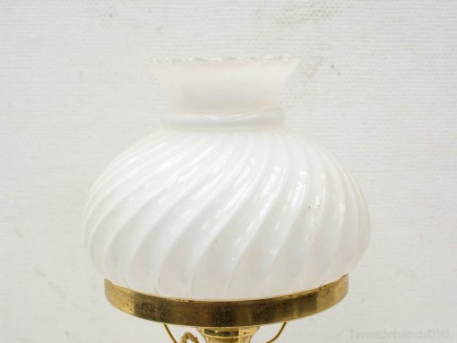 Elegant vintage lamp with white glass shade and brass base, ideal for charming interior decor.