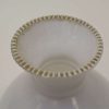 Elegant white ceramic vase with decorative rim, ideal for stylish home decor and floral arrangements.