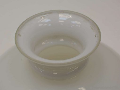 Elegant white ceramic bowl with a glossy finish, ideal for serving or decor.