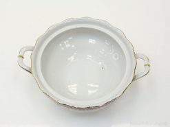 Elegant porcelain bowl with scalloped edges and gold accents, perfect for decor and special occasions.