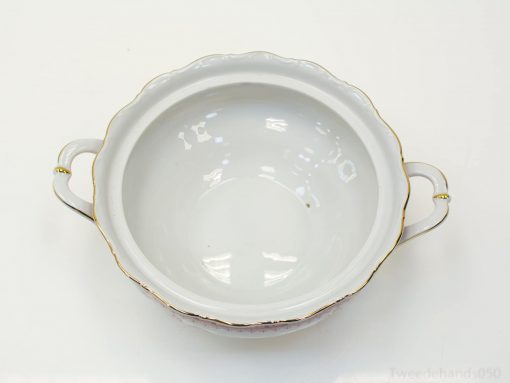 Elegant porcelain bowl with scalloped edges and gold accents, perfect for decor and special occasions.